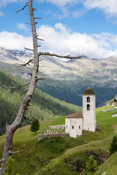 Beautiful old church in a typical swiss lanscape (canton of Grisons)