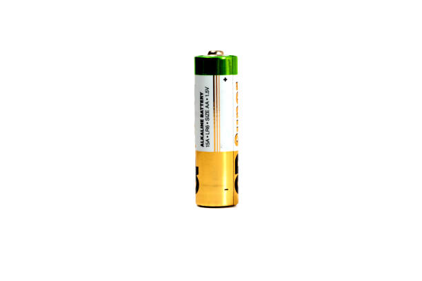 Several spent color alkaline batteries on a white background.