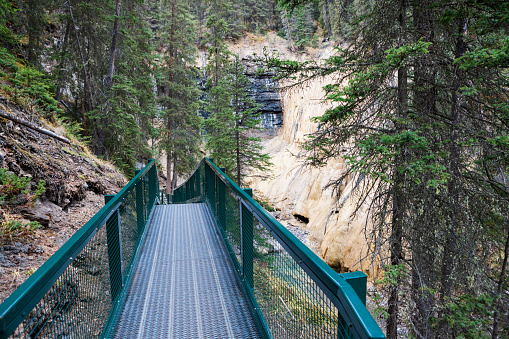 A trail through the beautiful wilderness landscape of Johnston Canyon at Banff National Park in the Canadian Rockies in Alberta, Canada.