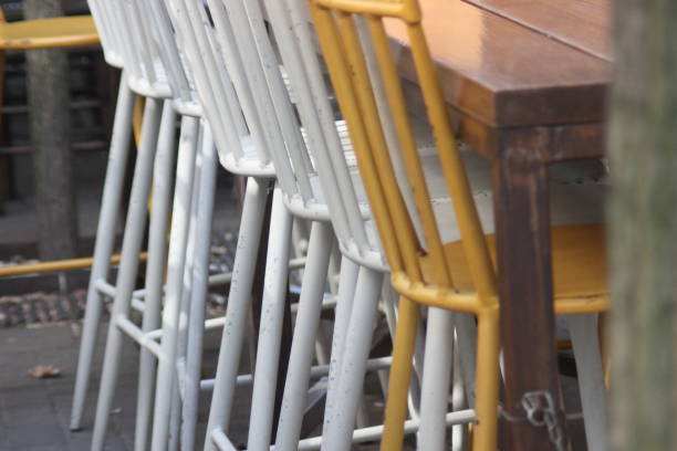 istock Sidewalk cafe chairs with Wine bottles 1025565852