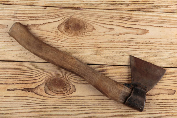 istock Old Axe on a wooden background 1025575422