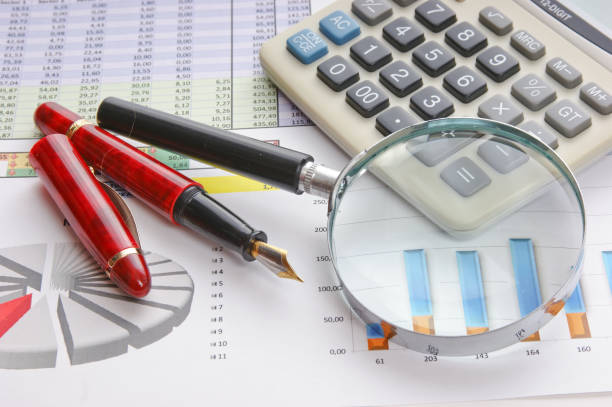 istock magnifying glass and the working paper 1025589638