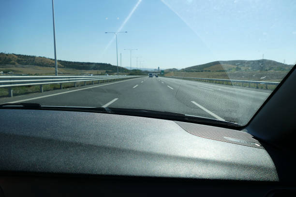 istock asphalt road view from the car, asphalt road strips, 1025597450