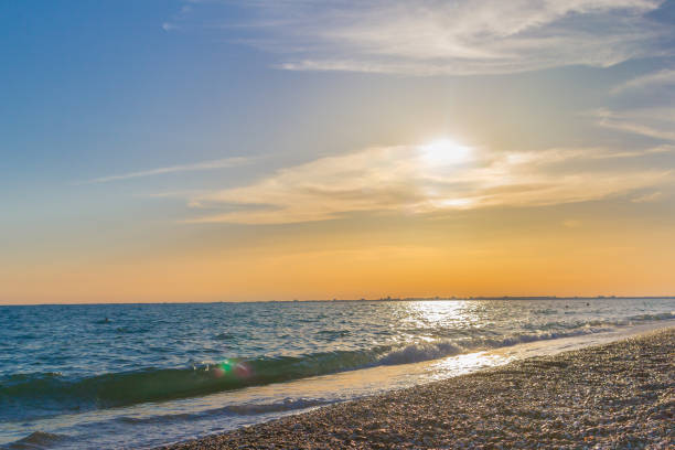 istock Beautiful summer sunset with clouds over the sea 1025604822