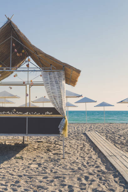 istock Wooden beach house decorated with sea shells on the beach 1025608600