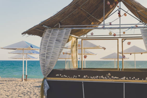 istock Wooden beach house decorated with sea shells on the beach 1025608740