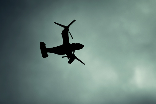 Silhouette Mv-22 Osprey on the moody sky in London.