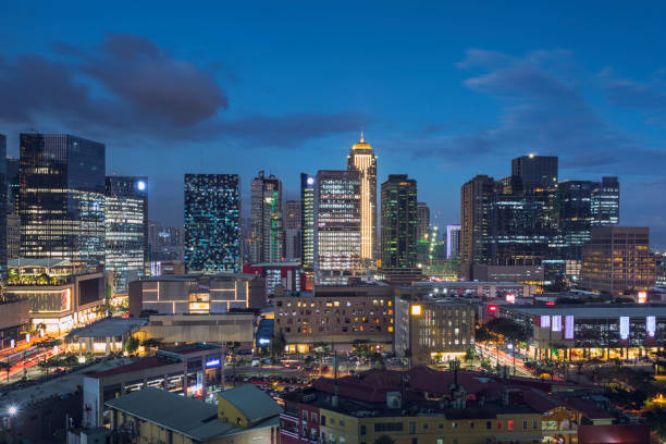 Bonifacio Global City in the evening Evening view of Bonifacio Global City, a modern business and lifestyle district in Metro Manila, Philippines. taguig stock pictures, royalty-free photos & images