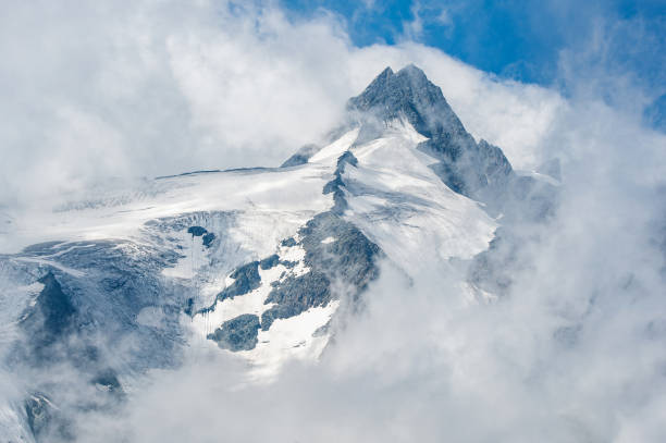 Großglockner mountain top in the fog - Austria Großglockner mountain top in the fog - Austria grossglockner stock pictures, royalty-free photos & images