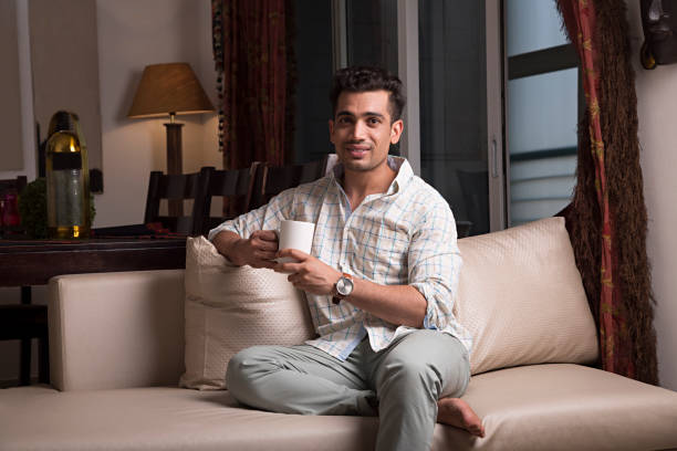 Handsome man at home - Stock image