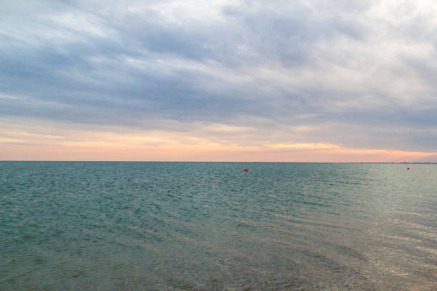 istock Beautiful summer sunset with clouds over the sea 1025613698