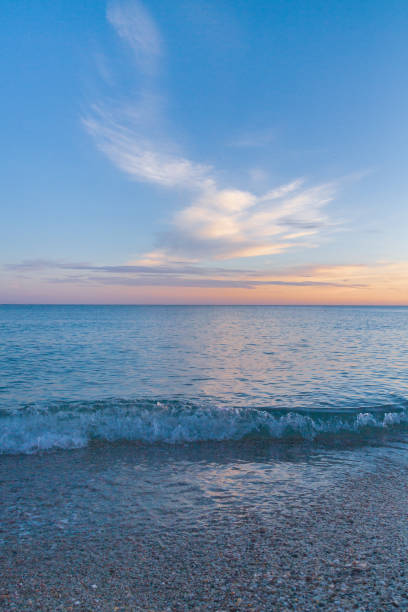 istock Beautiful summer sunset with clouds over the sea 1025614618
