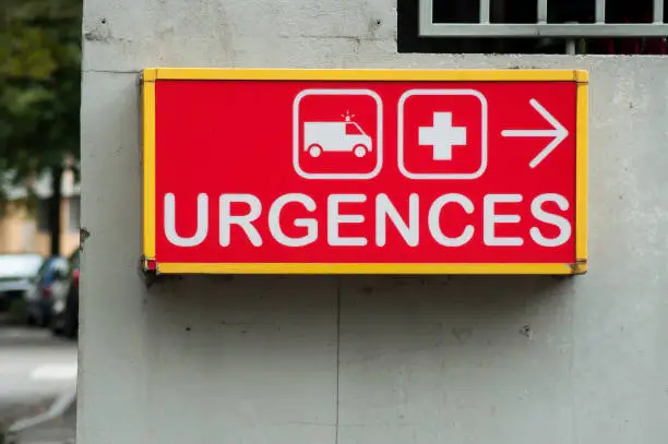 Photo of french hospital emergency entry sign with text in french ( urgences)