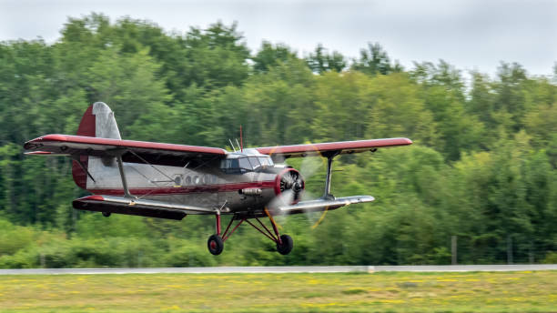 istock Vintage biplane landing 1025621668
