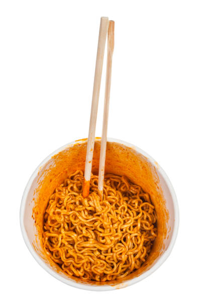 istock chopsticks in cooked spicy instant noodles 1025622294