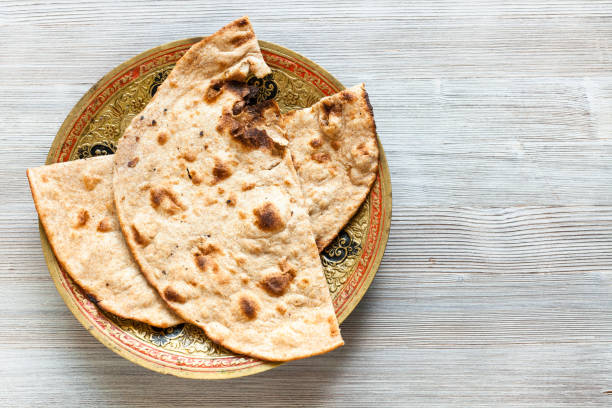 istock Tandoori Roti whole wheat flat bread on gray table 1025630430