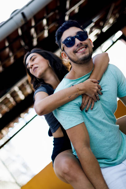 istock Young man carrying his girlfriend on his back 1025645856