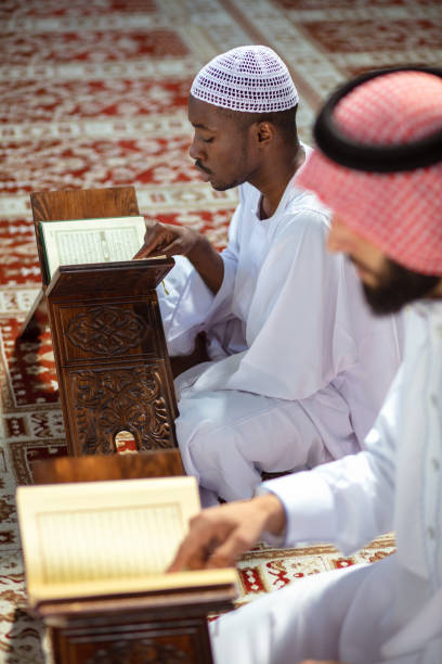 istock Two religious Muslim man praying together inside the mosque 1025651610