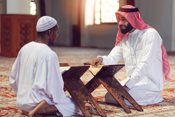 istock Two religious Muslim man praying together inside the mosque 1025652126