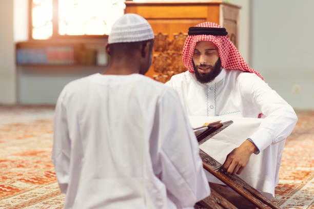 istock Two religious Muslim man praying together inside the mosque 1025661186