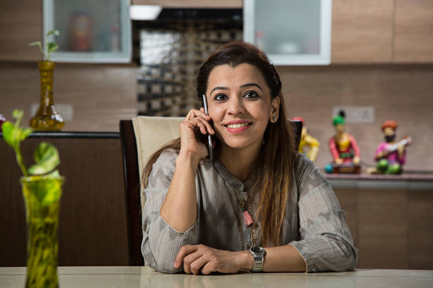 istock Beautiful woman on mobile - Stock image 1025661356