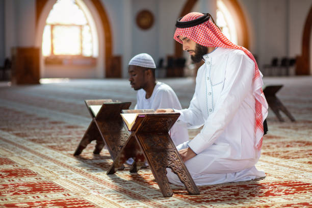 istock Two religious Muslim man praying together inside the mosque 1025661646