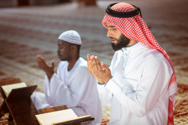 istock Two religious Muslim man praying together inside the mosque 1025665830