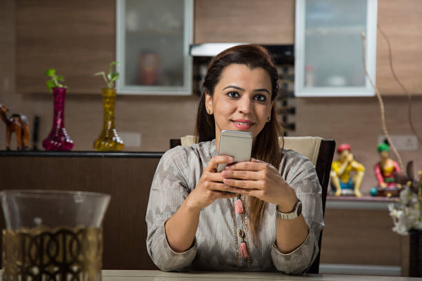 istock Businesswoman using smartphone - Stock image 1025666030