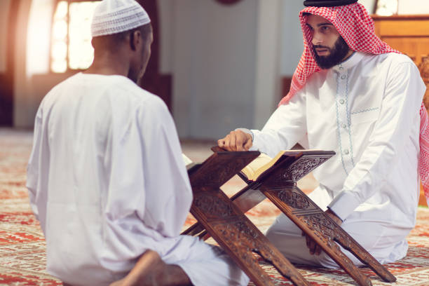 istock Two religious Muslim man praying together inside the mosque 1025666110