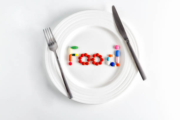 istock A dinner plate assorted pills and capsules forming food word or sign with a fork and knife 1025670638