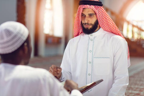 istock Two religious Muslim man praying together inside the mosque 1025670804