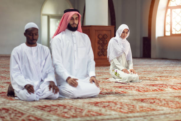 istock Two religious Muslim man praying together inside the mosque 1025675180
