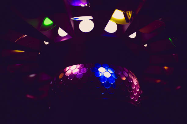 istock Dancing under disco mirror ball night club background 1025675300