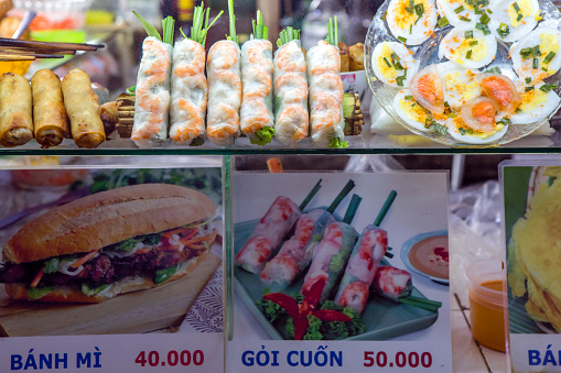January 22, 2018 - Ho Chi Minh City, Vietnam: Vietnamese restaurant street food menu dislpay at a market stall in Ben Thanh Market in District 1 of Ho Chi Minh City, Vietnam.