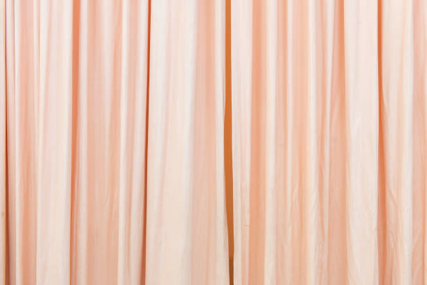 istock white curtain slightly open in the comfortable room for background 1025684804