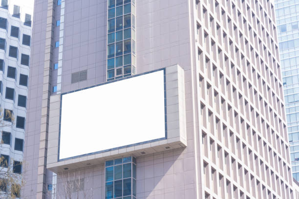 istock Blank billboard or advertising poster on the building wall mock up, for advertisement concept background 1025684816