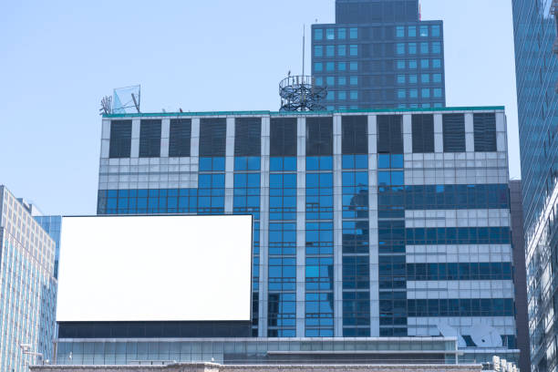 istock Blank billboard or advertising poster on the building wall mock up, for advertisement concept background 1025684840