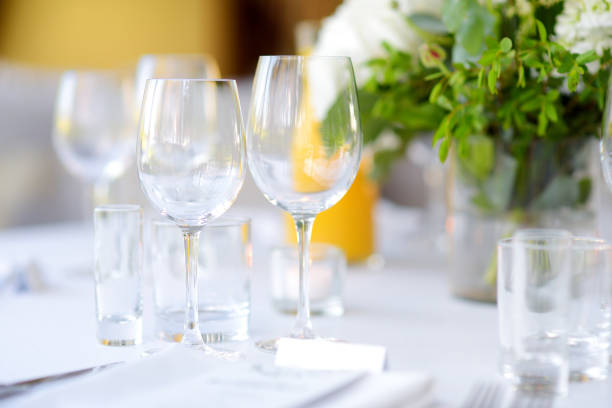 istock Beautiful table setting with crockery and flowers for a party, wedding reception or other festive event 1025694736