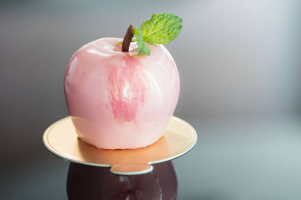 slice of homemade apple pie with near two fruits
