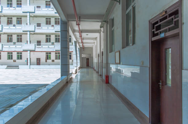 Looking at the teaching building on the university campus from the bottom corridor