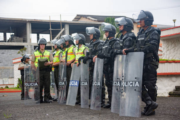 Cuenca, Ecuador / August 13, 2015 - Riot police stand in formation, guarding against potential trouble at a political protest