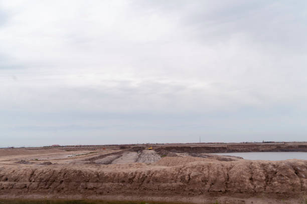 istock barren farm land under overcast sky 1025736384