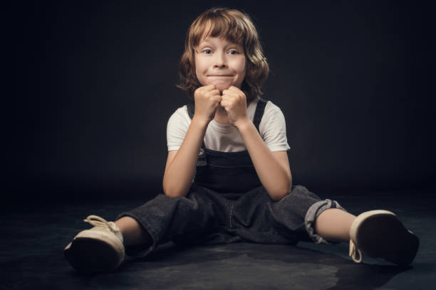 istock child emotionally posing on camera in the Studio on a white background 1025742500