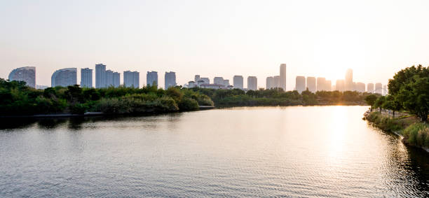 istock Landscape of skyscraper and lake on sunset 1025749484