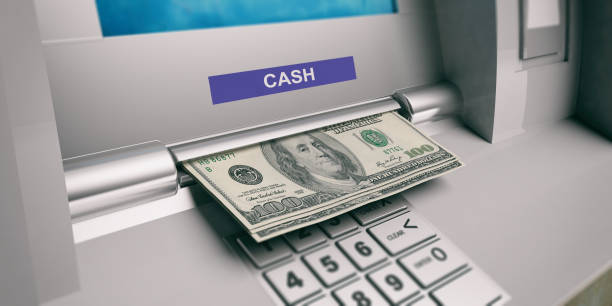 Dollars out of a ATM machine. 3d illustration American dollars banknotes and ATM machine close up. 3d illustration exchange teller stock pictures, royalty-free photos & images