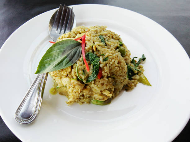 istock Fried rice with green curry with meat. Thai food 1025776534