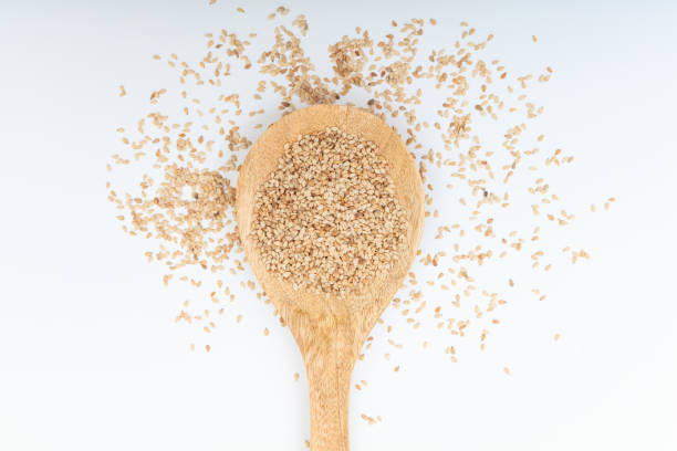 istock Sesame seeds in a wooden spoon 1025781594