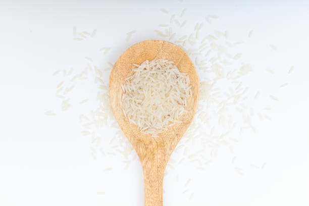 istock Raw basmati rice in a wooden spoon 1025781614