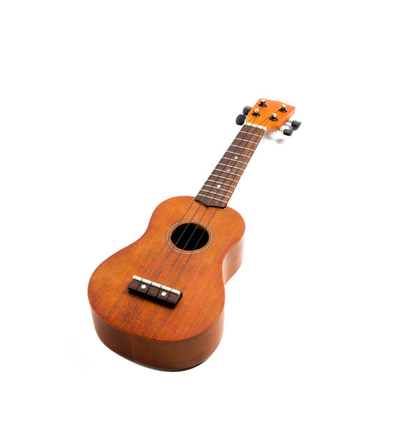 istock The brown ukulele on the white background, with Clipping path 1025781842