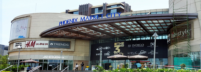 People visiting Phoenix Market City mall for shopping in Pune city of Maharashtra state of India. This is the biggest shopping mall of Pune City. Pune is known as Information Technology hub and hosts hundreds of top MNCs in different IT special zones.
